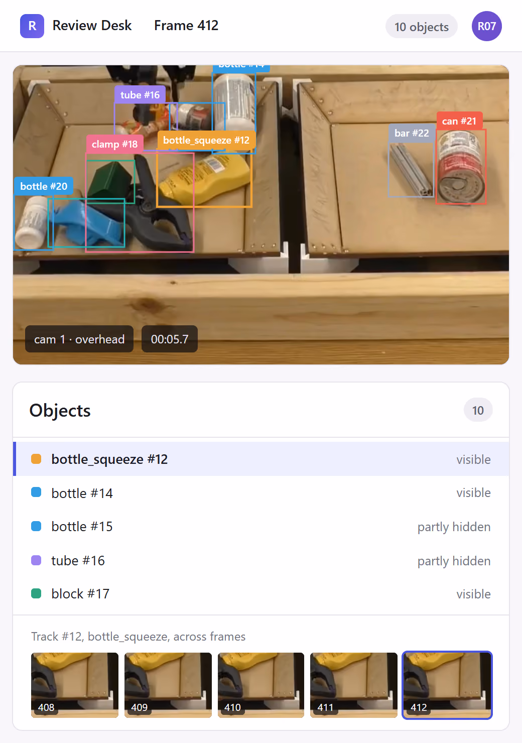 Frame 412 on a phone: boxes with class and track ID on the objects in both trays, and the object list with occlusion.