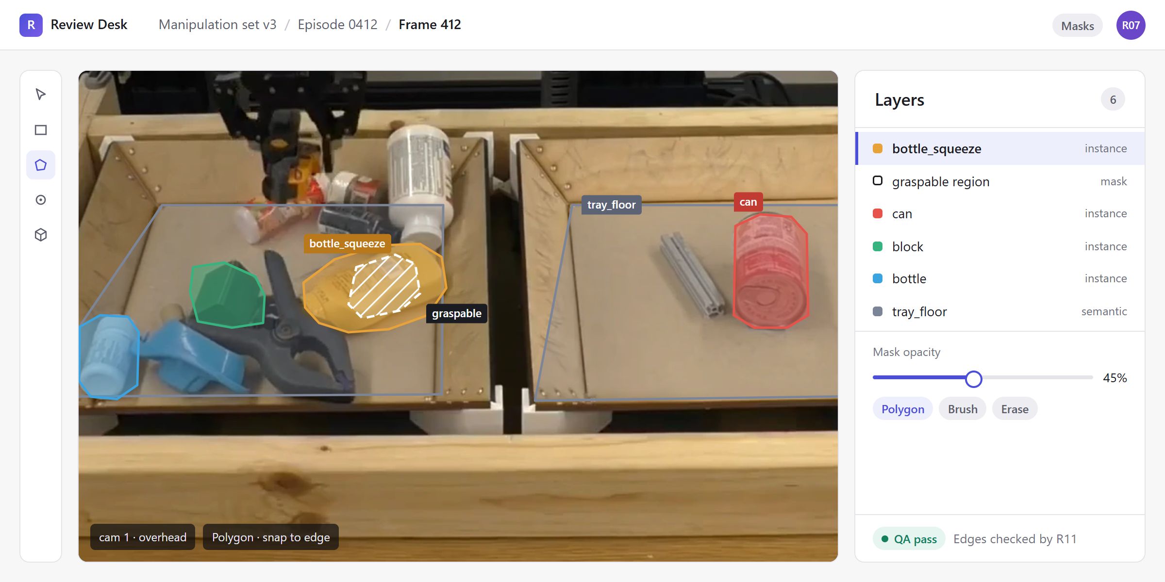 Frame 412 in our labelling workspace: instance masks on the squeeze bottle, can, block and a bottle, semantic masks on both tray floors, and a hatched graspable region on the squeeze bottle, with mask opacity and polygon, brush and erase tools.